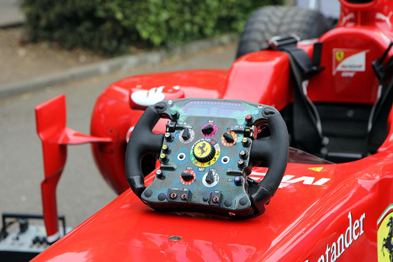 The steering-wheel of the Ferrari F10.  How does one have time to look at the track! 