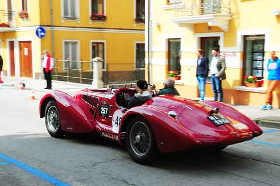 Egon Tauscher and Gina Albrecht head through Asiago in Alfa Romeo 6C 2500 SS.