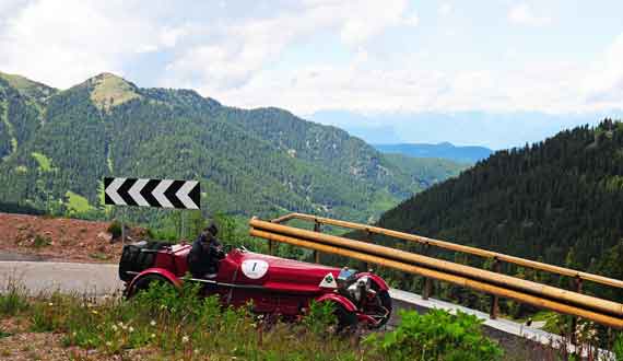 Fabulous Alfa RL of Venanzioro Fonte and Nat Weaver negotiates a hairpin on the Passo Manghen.