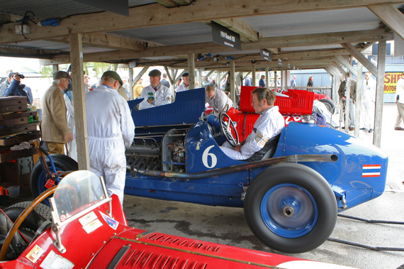 It is always a good idea to make your way to the paddock area first thing on the Saturday morning. This allows you to see the entrants for the Goodwood Trophy. Here we see the mechanics warming the transmission of the ex Birra Maserati 8CM of Christopher Jaques .